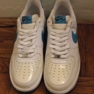 Low top white and light blue Air Force 1s.